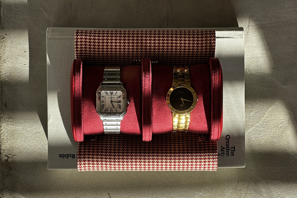 Cartier Santos and vintage Gucci watch on suede pillows in a Winsome houndstooth double watch roll