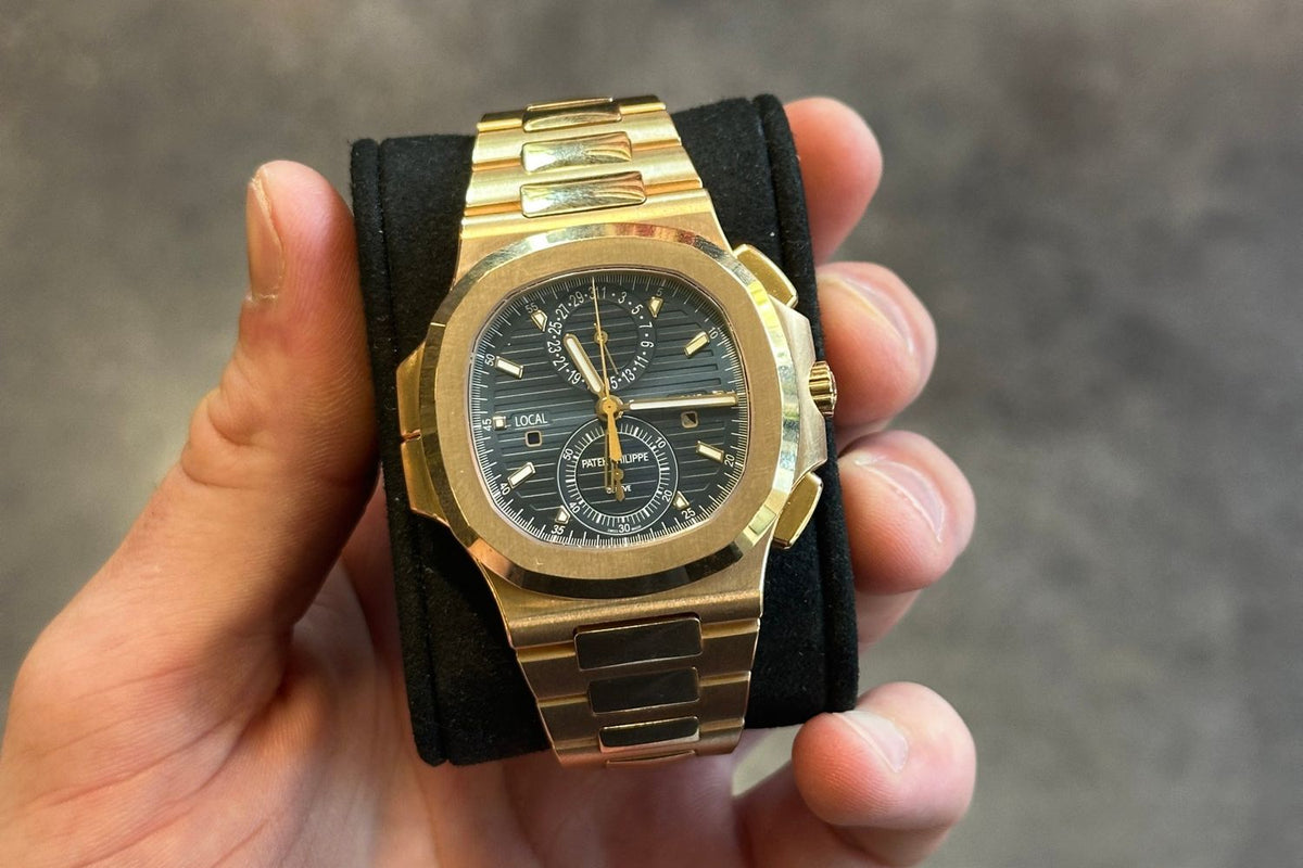 Rose gold Patek Philippe Nautilus Travel Time Chronograph with blue dial