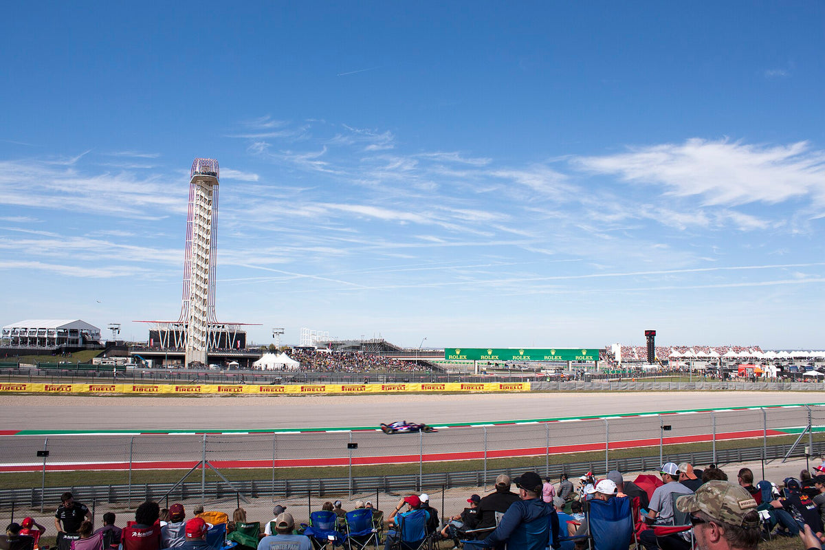 Formula 1 car on track at Circuit of the Americas in Austin during the 2018 United States Grand Prix, with the observation tower behind